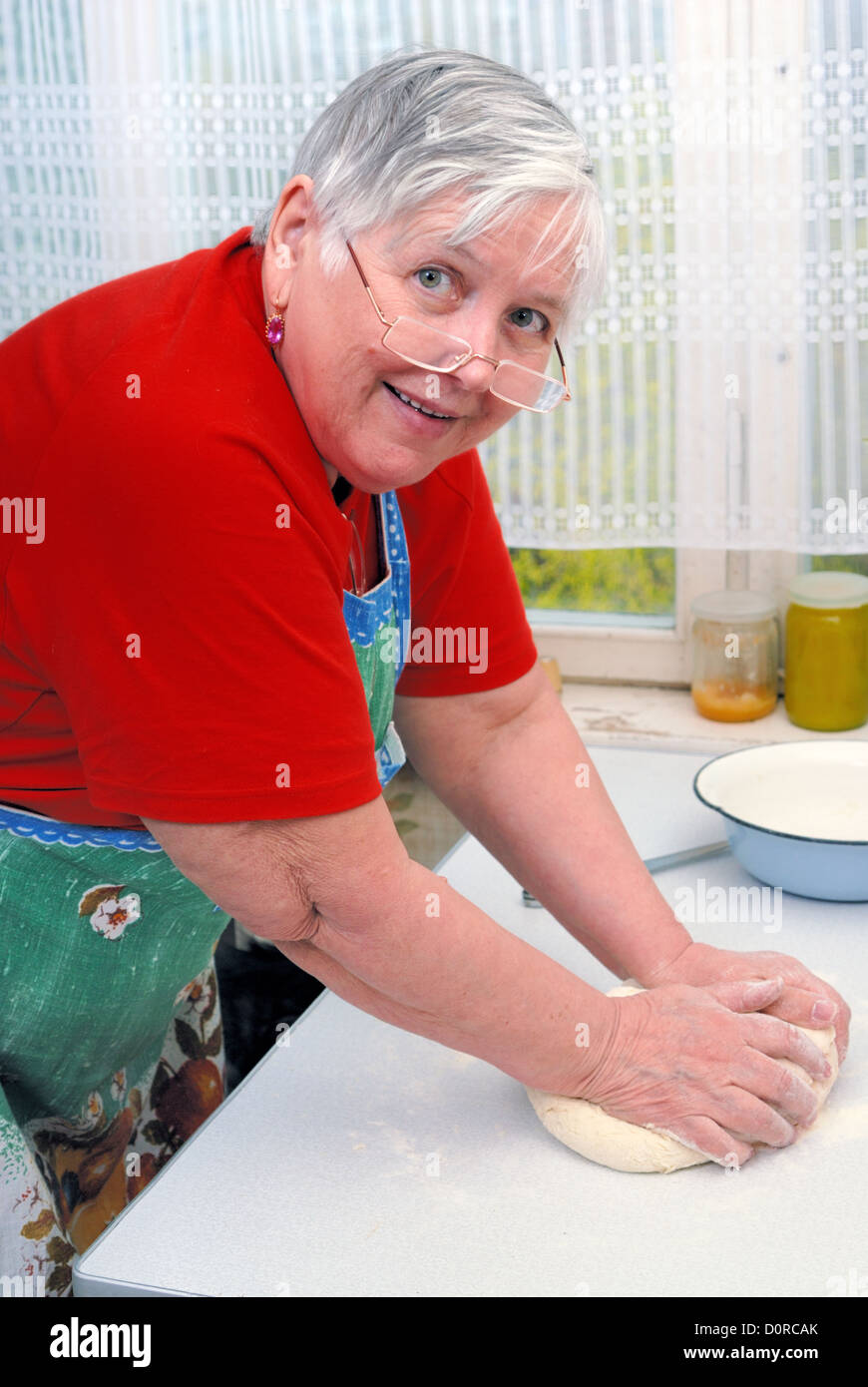 Woman kneading dough Stock Photo - Alamy