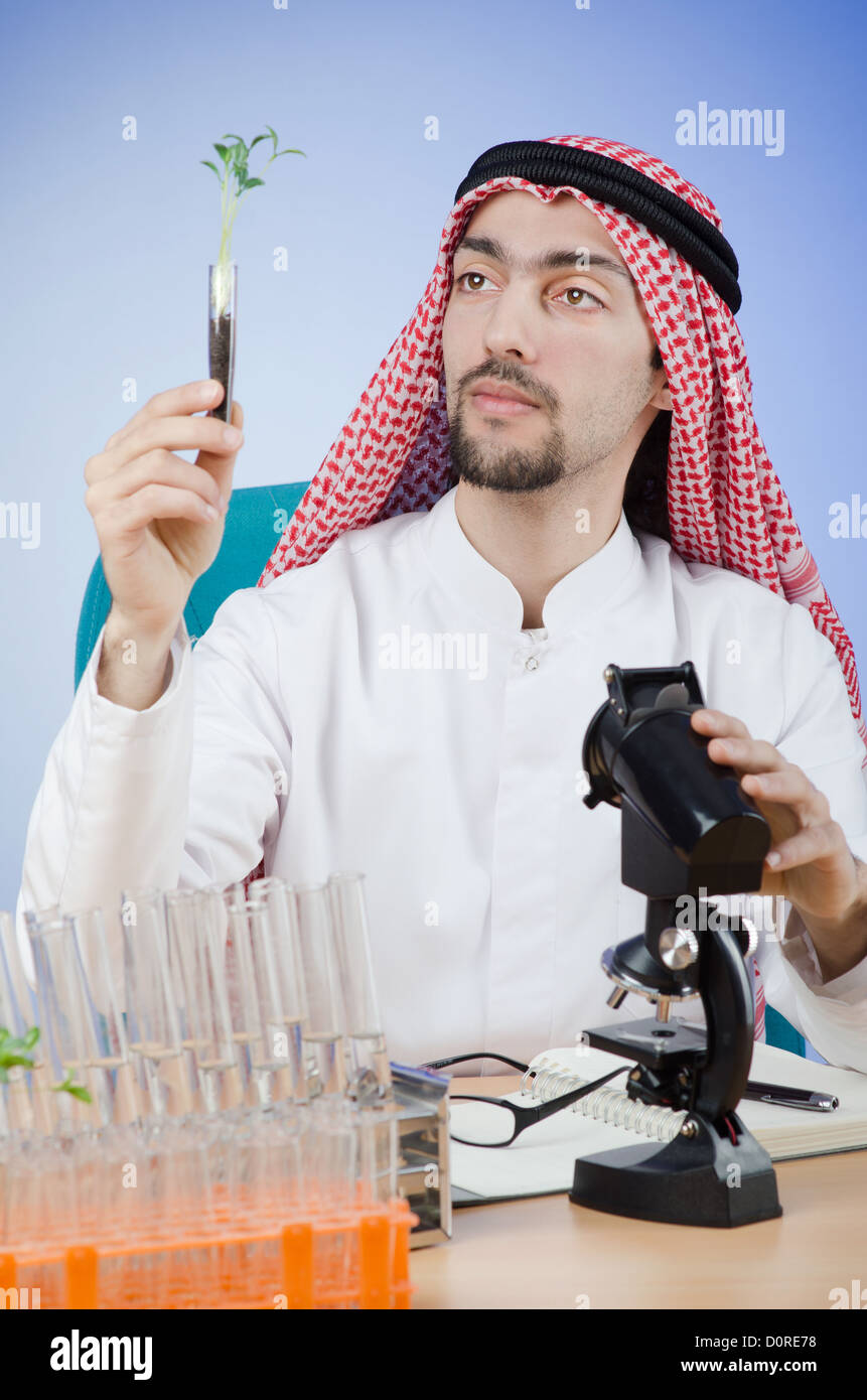 Arab chemist working in lab Stock Photo