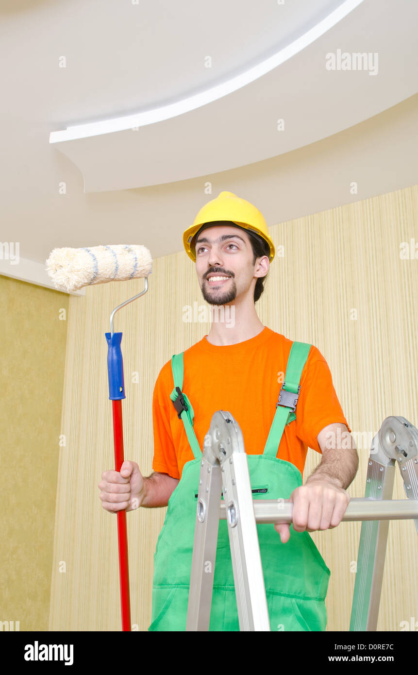 Painter worker during painting job Stock Photo Alamy