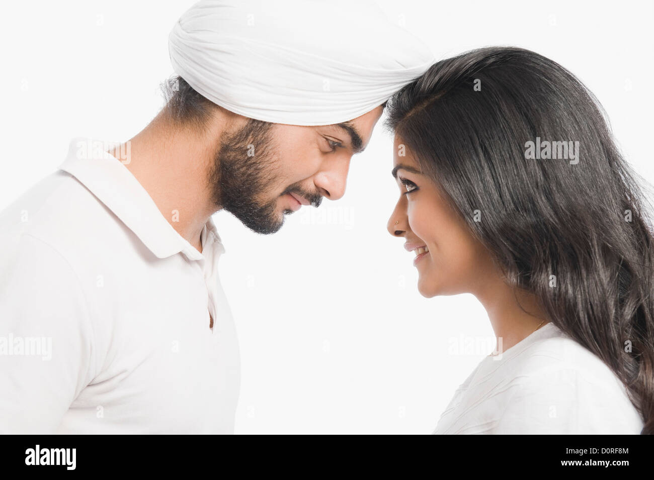 Couple smiling at each other Stock Photo - Alamy