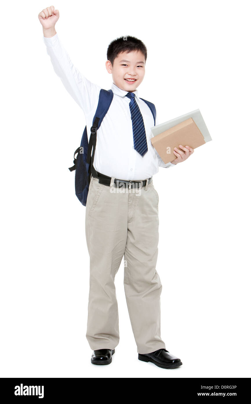 Confident schoolboy punching the air with books Stock Photo Alamy