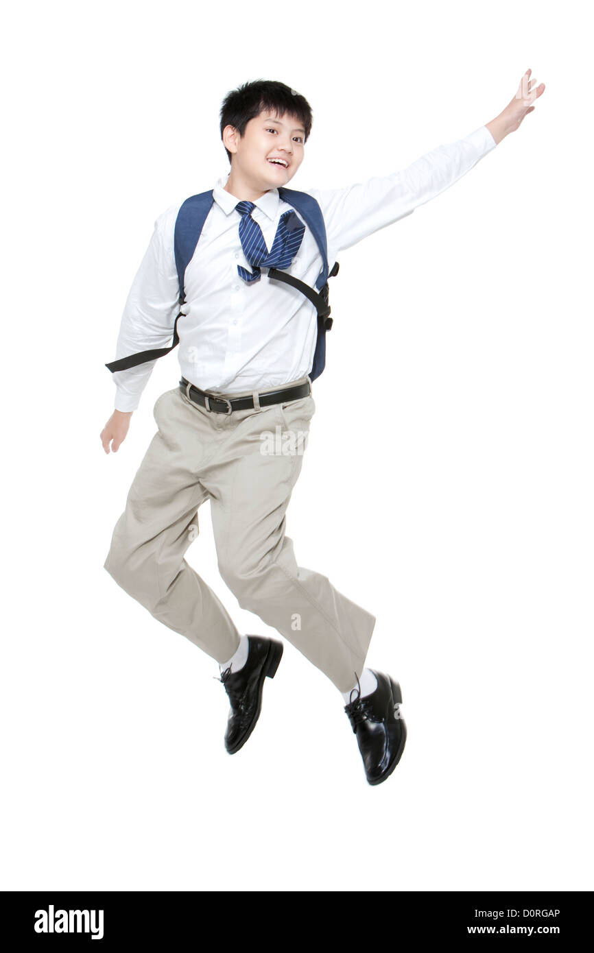 Happy schoolboy jumping with schoolbag on the back Stock Photo - Alamy