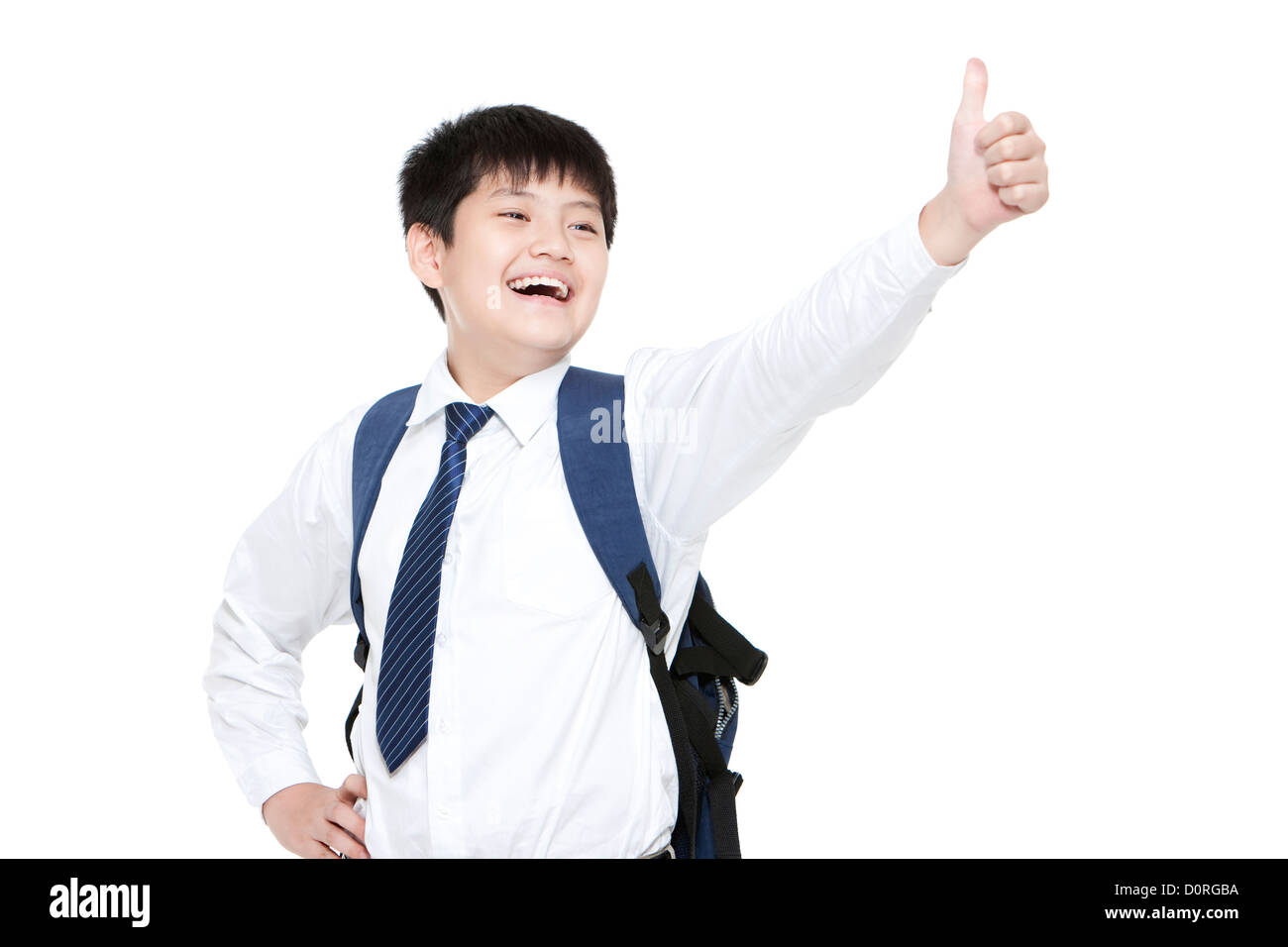 Delighted schoolboy showing thumbs up Stock Photo - Alamy