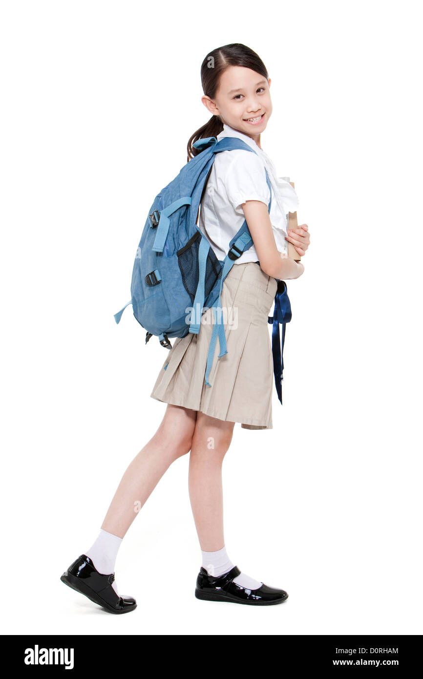 Happy schoolgirl with books and schoolbag on the back Stock Photo - Alamy