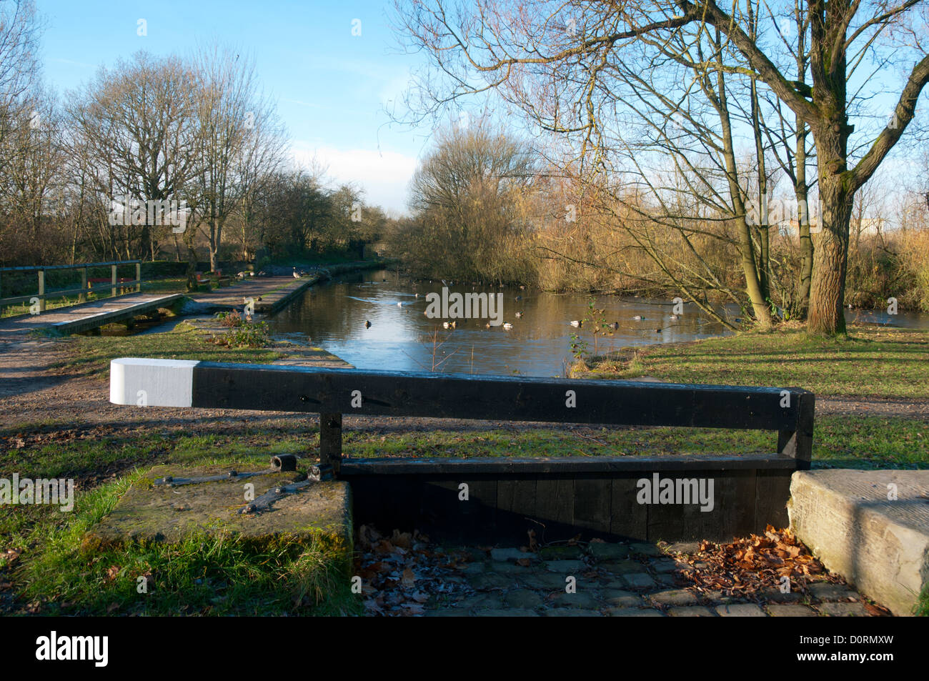Seat made in the form of a canal lock gate, Daisy Nook Country Park, Failsworth, Manchester, UK Stock Photo