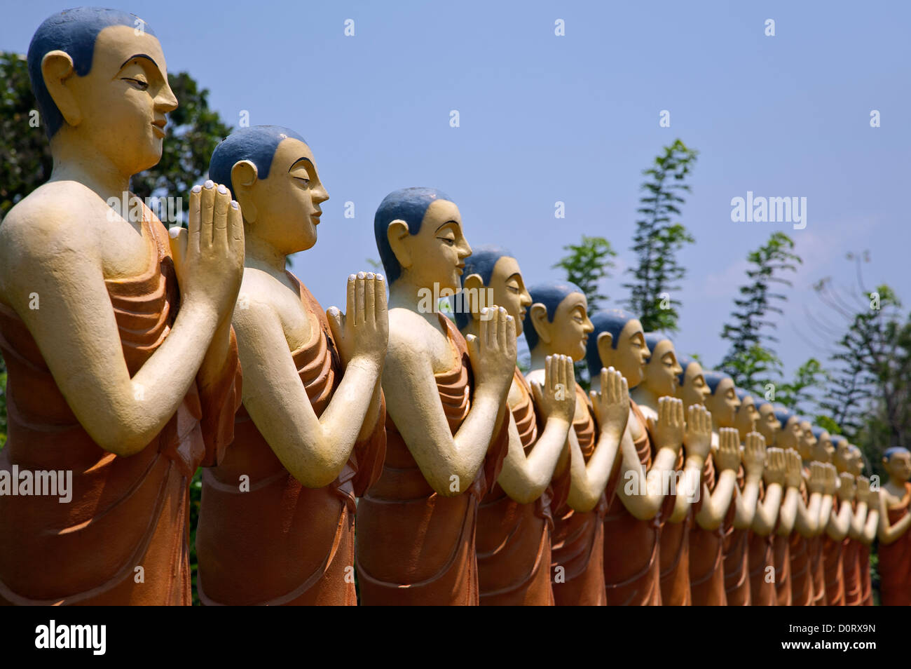 Praying buddhist monk statues hi-res stock photography and images - Alamy