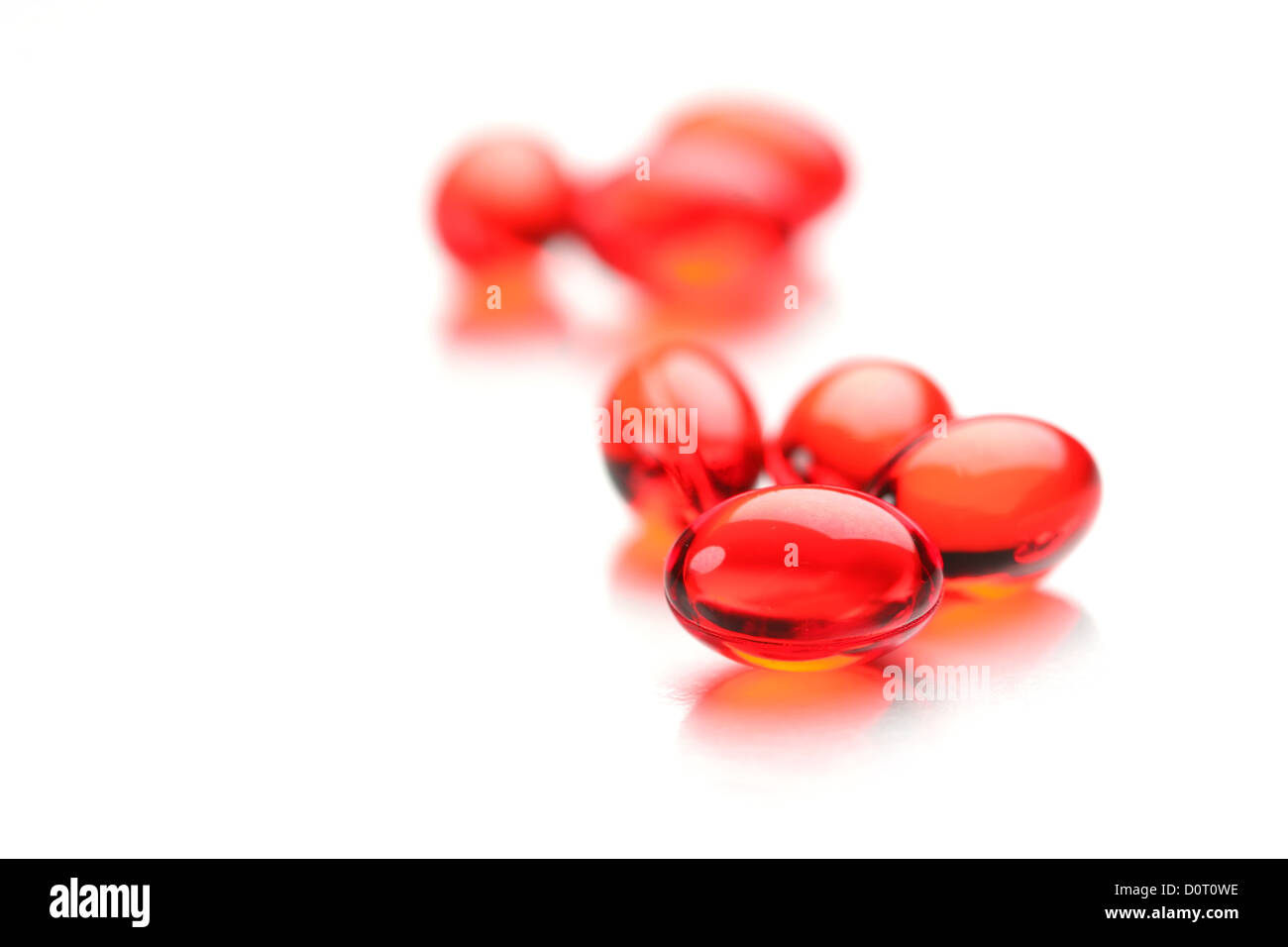 Bright Red Capsules Stock Photo - Alamy