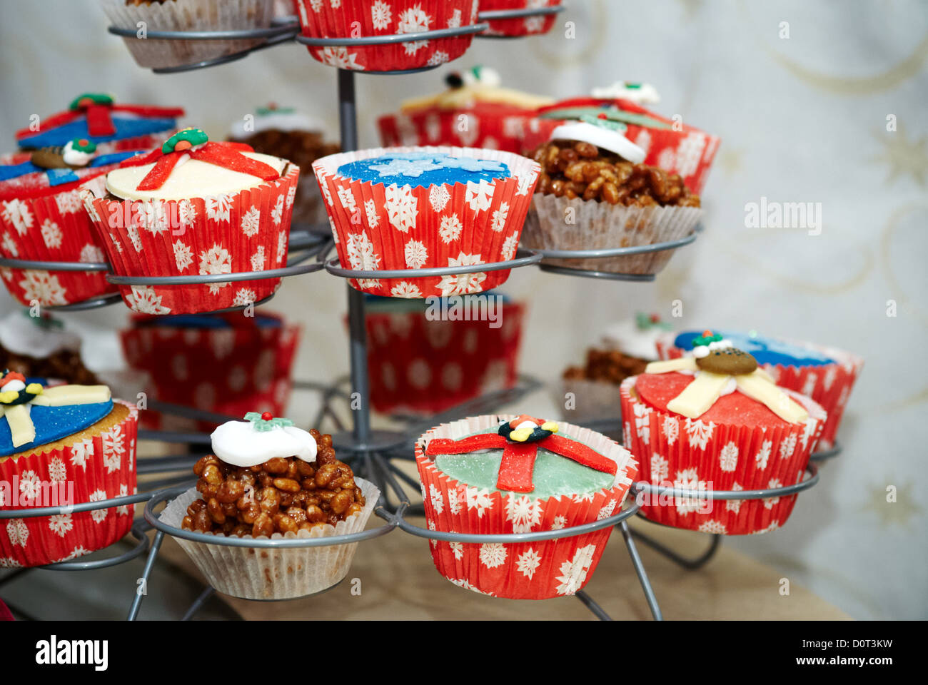 A stack of fairy cakes decorated in a Christmas theme Stock Photo