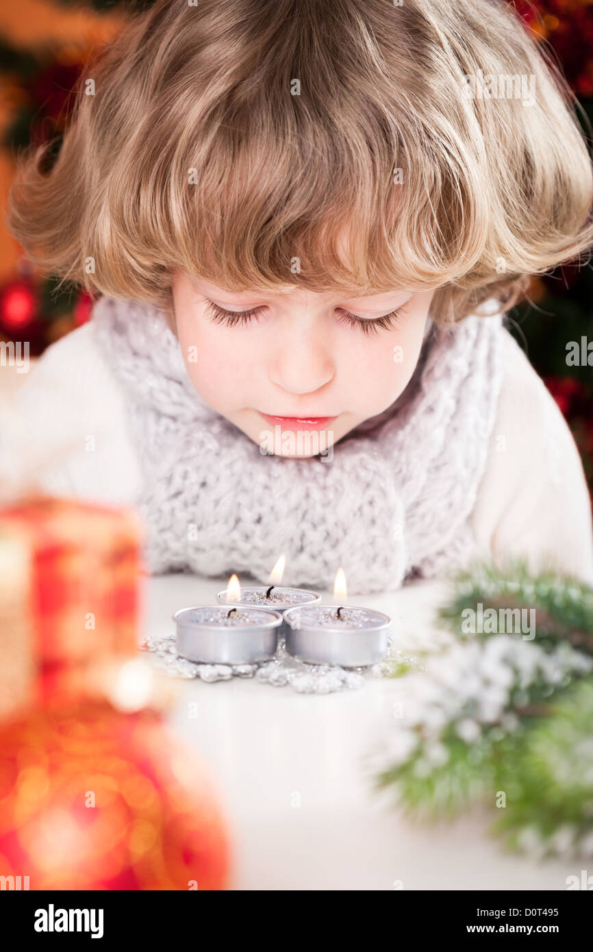 Child blowing out candles Stock Photo Alamy