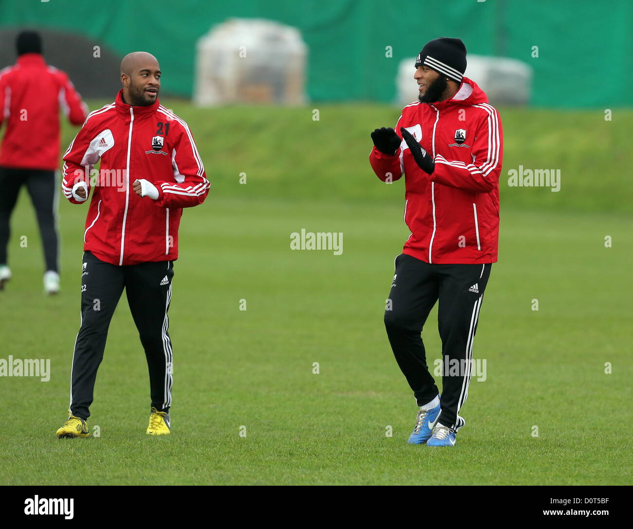 Wales, UK. Friday, 30 November 2012  Pictured L-R: Dwight Tiendali and Kemy Agustien   Re: Swansea City FC, training at the Llandarcy training ground in south Wales. Stock Photo