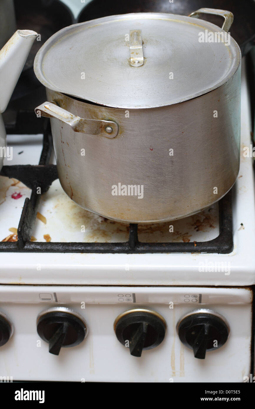 pan on old dirty gas stove Stock Photo Alamy