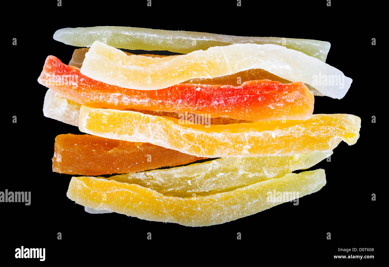 Dried papaya bars in sugar on black background Stock Photo Alamy