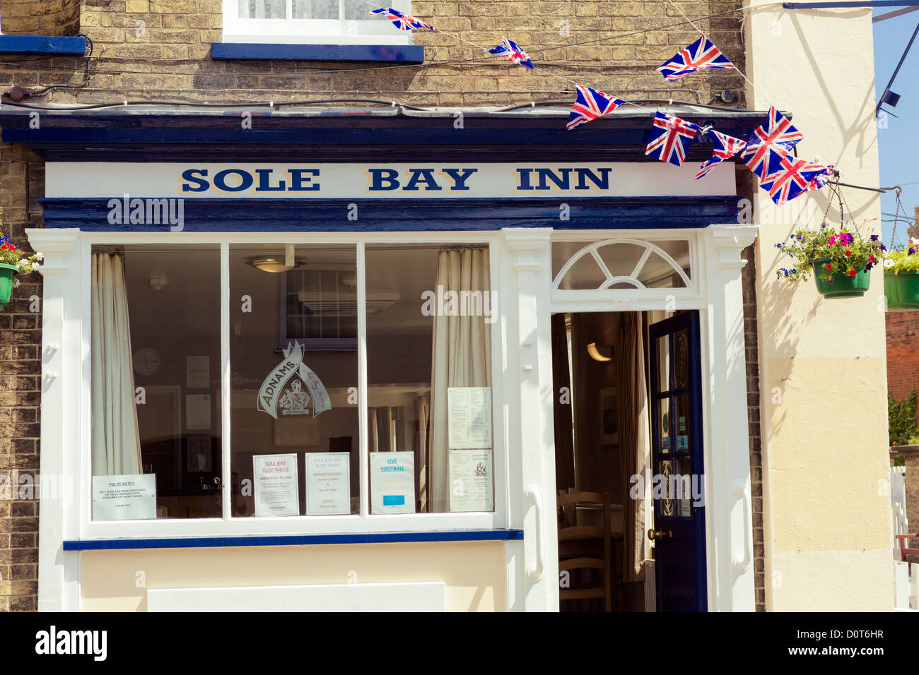 Sole Bay Inn public house and lighthouse in Southwold, Suffolk, UK