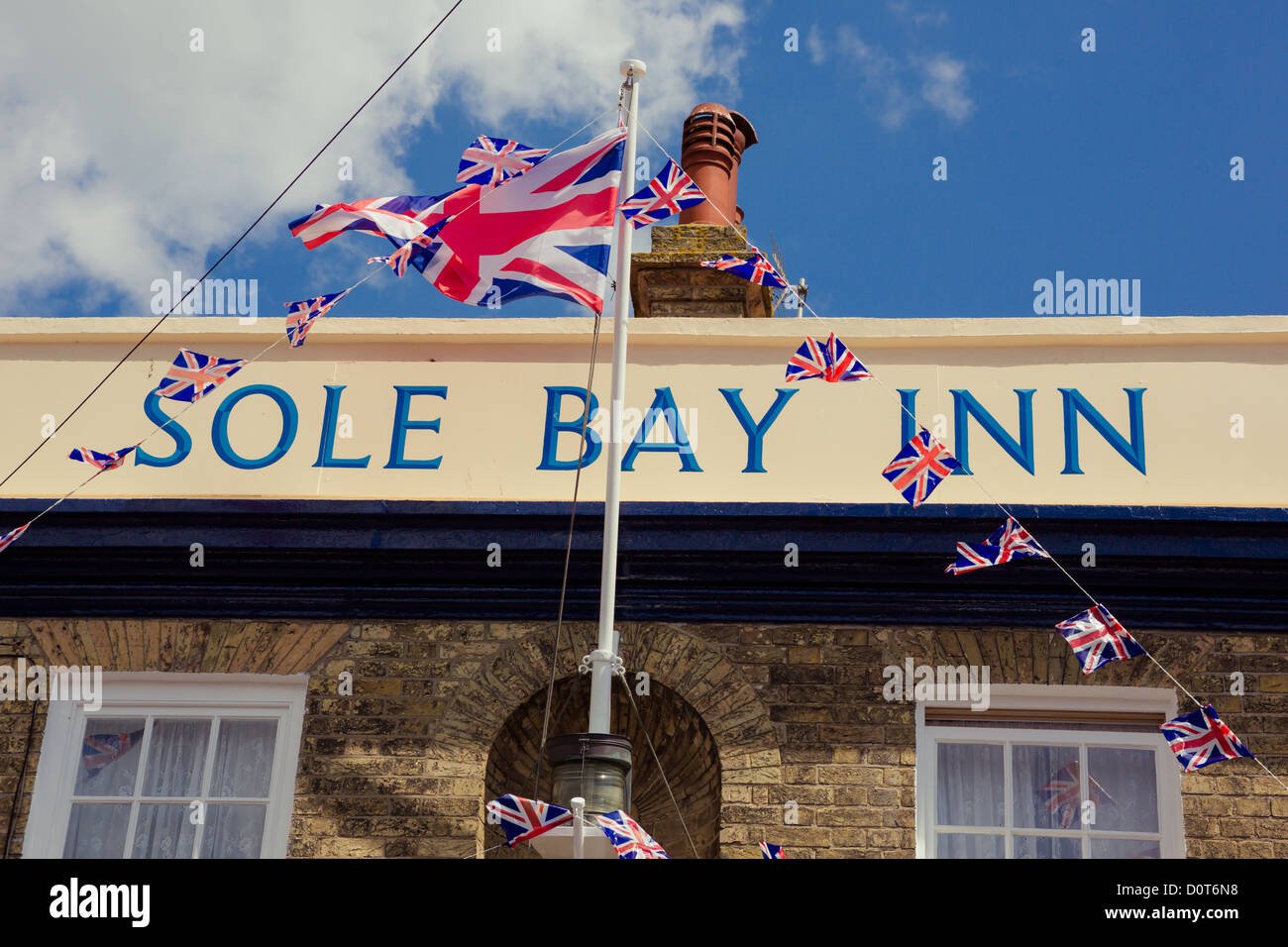 Sole Bay Inn public house and lighthouse in Southwold, Suffolk, UK