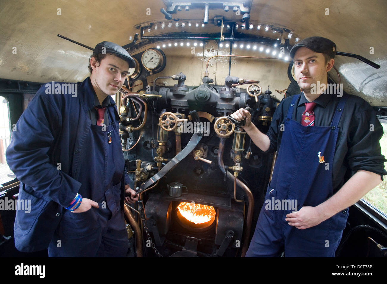 A driver and a fireman on a steam locomotive on the Strathspey Railway in the Scottish Highlands, Scotland, Britain UK Stock Photo