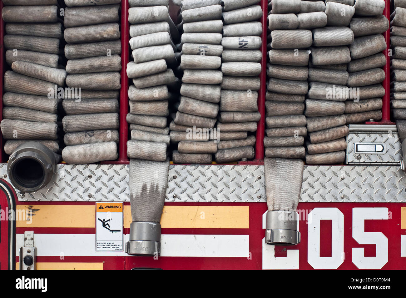 Hoses neatly loaded in the back of a FDNY firetruck in Brooklyn, NYC. Stock Photo