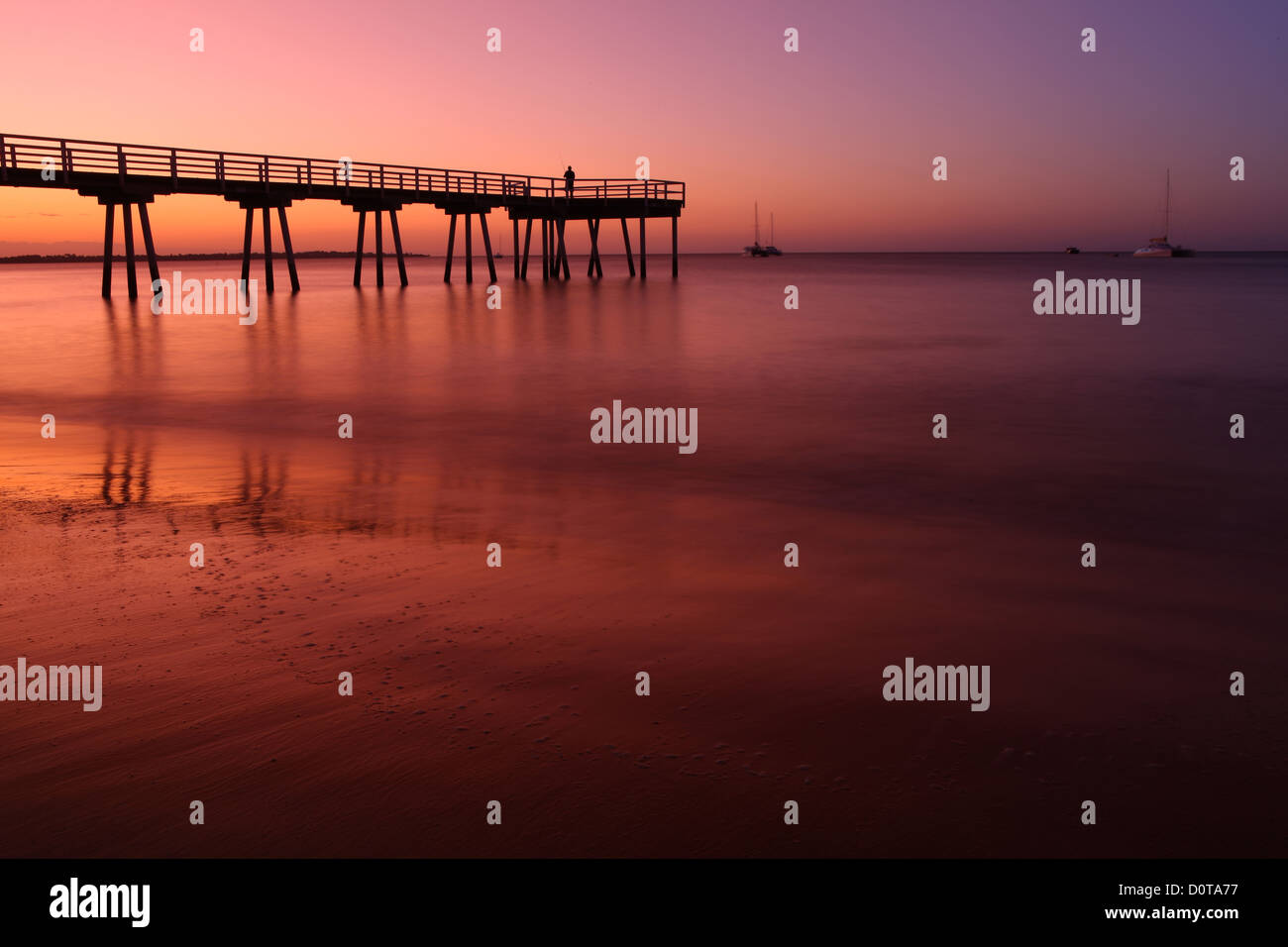 Hervey Bay, Queensland, Australia, east coast, Sundown, sunset, Pier, footbridge, sea, waves, fisherman, sail boat, yacht, roman Stock Photo