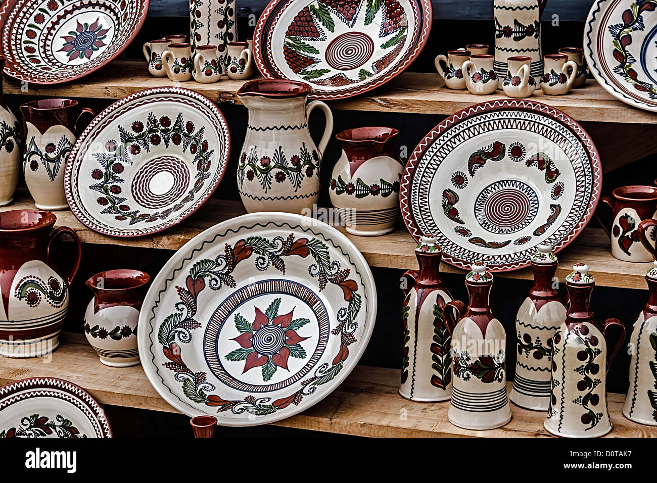 Romanian traditional pottery in the form of plates, painted with specific  reasons Corund area, Transylvania Stock Photo - Alamy