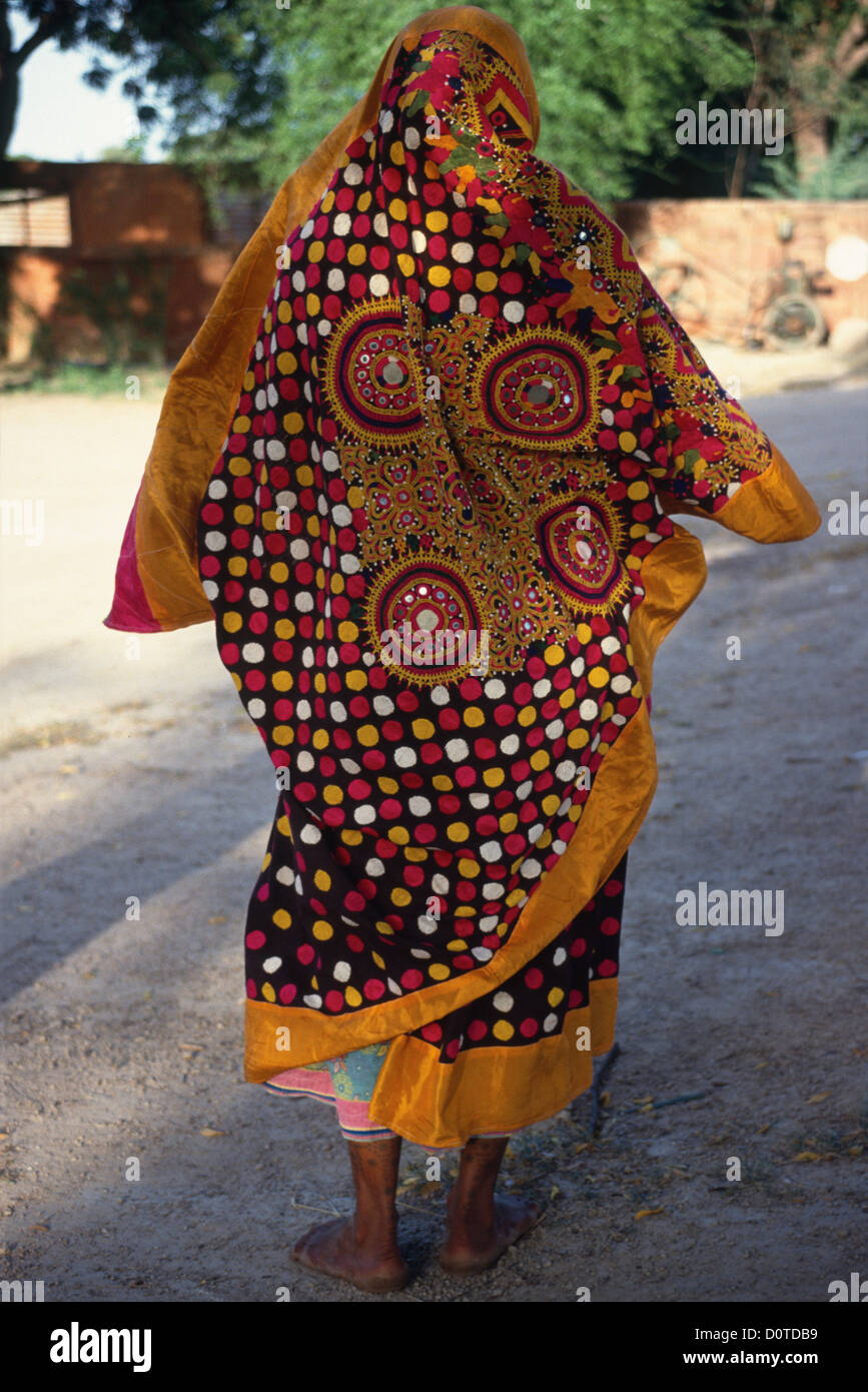 Back of woman wearing traditional embroidered clothing. Stock Photo