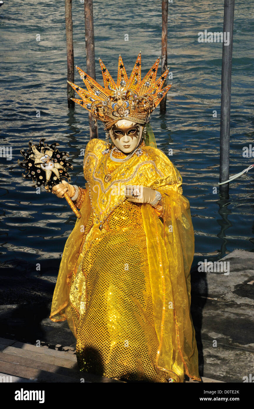 Masked participant during Carnival in Venice, Italy photographed in the evening in the Santa Maria della Salute district. Stock Photo