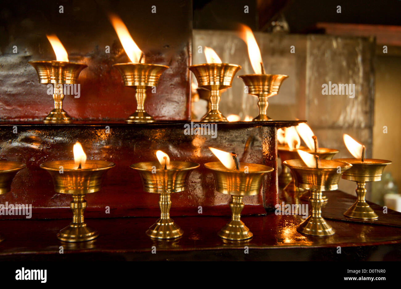 Burning candles in the Buddhist temple Stock Photo Alamy