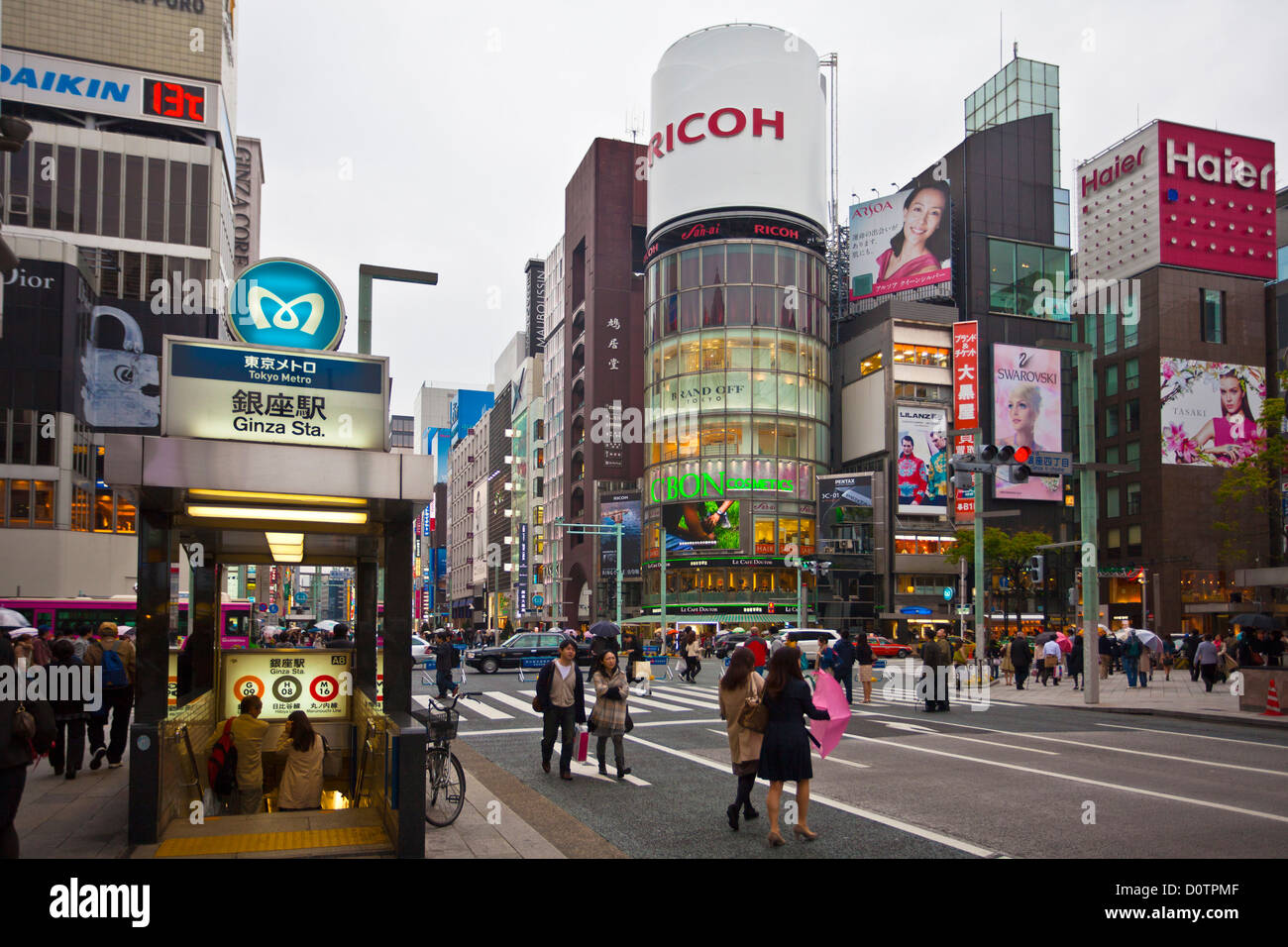 Japan, Asia, holiday, travel, Tokyo, City, Ginza, District, Chuo, Avenue, Wako, Corner, modern, building, rainy, people, shoppin Stock Photo