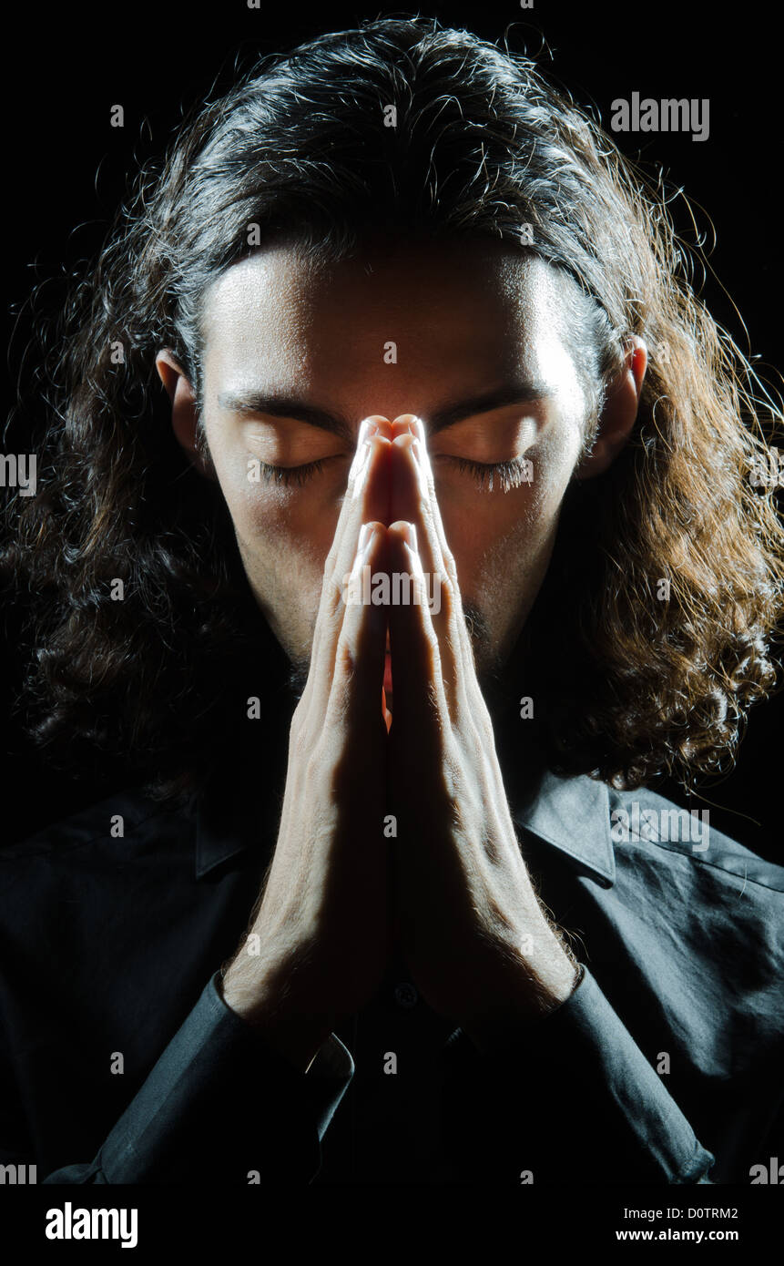Young Man Praying In Darkness Stock Photo Alamy young-man-praying-in-darkness-stock-photo-alamy