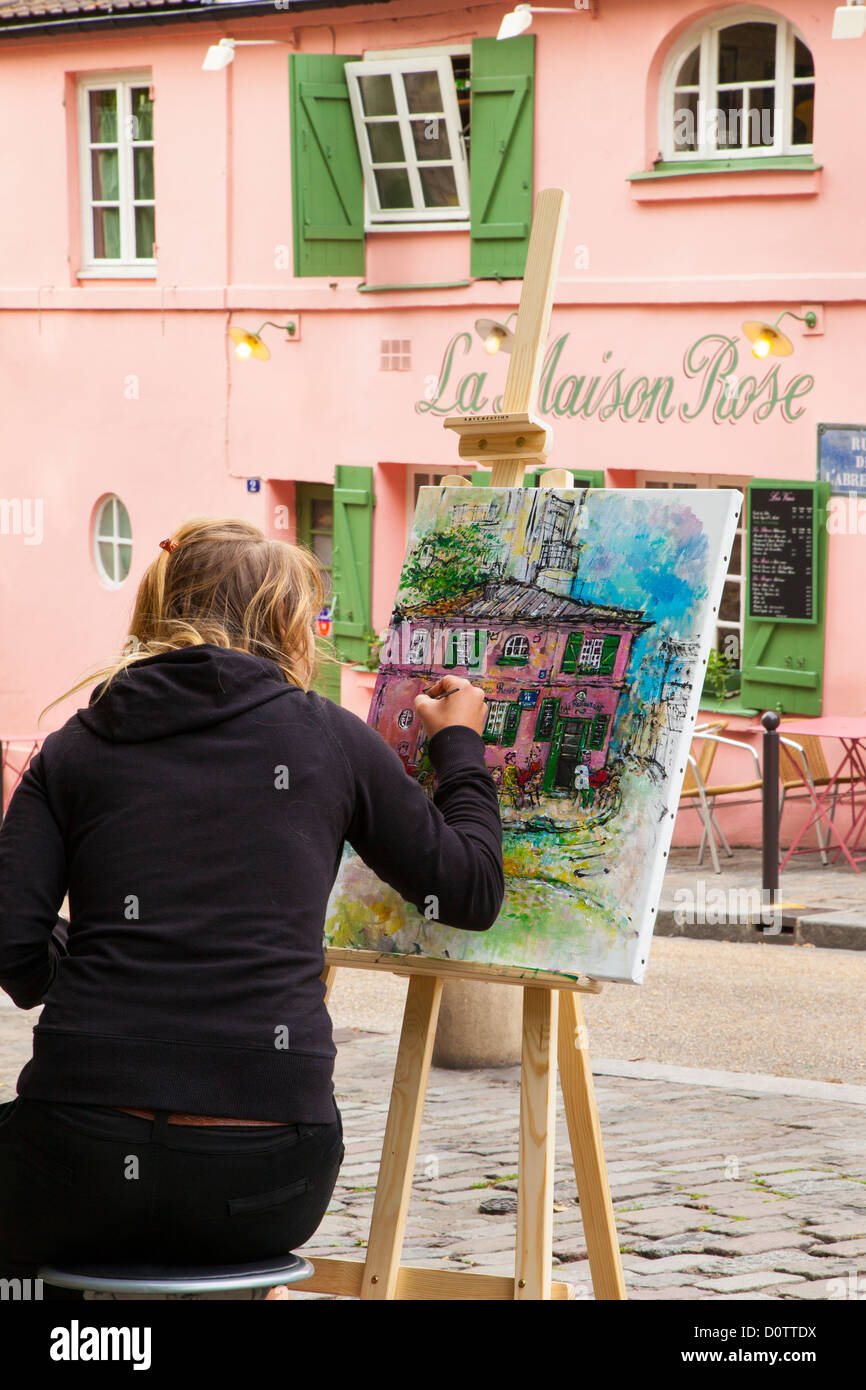 Artist painting a cafe scene in Montmartre, Paris France Stock Photo