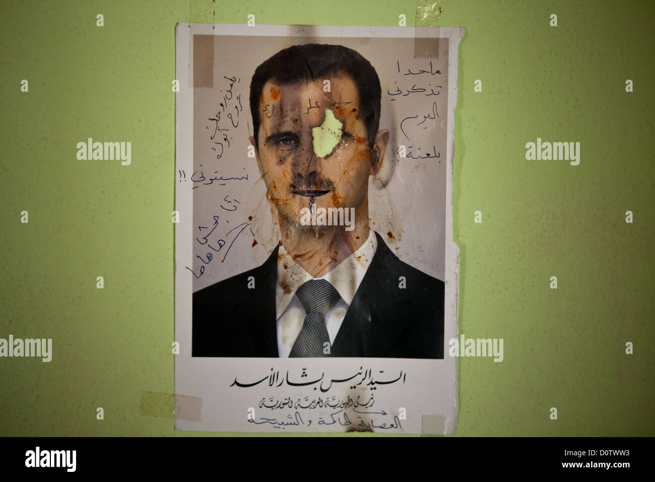 01/10/12, Syria. Photograph of Bashar al-Assad adorns a hospital wall. A patient who had lost an eye took a lighter to it. Stock Photo