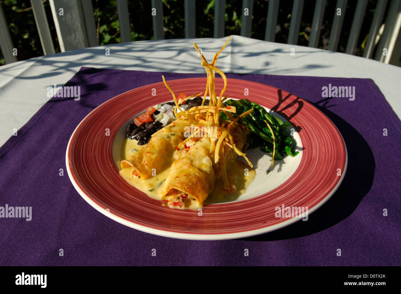 Blue crab enchiladas with mango jalapeno cream sauce in Port Aransas Texas Stock Photo