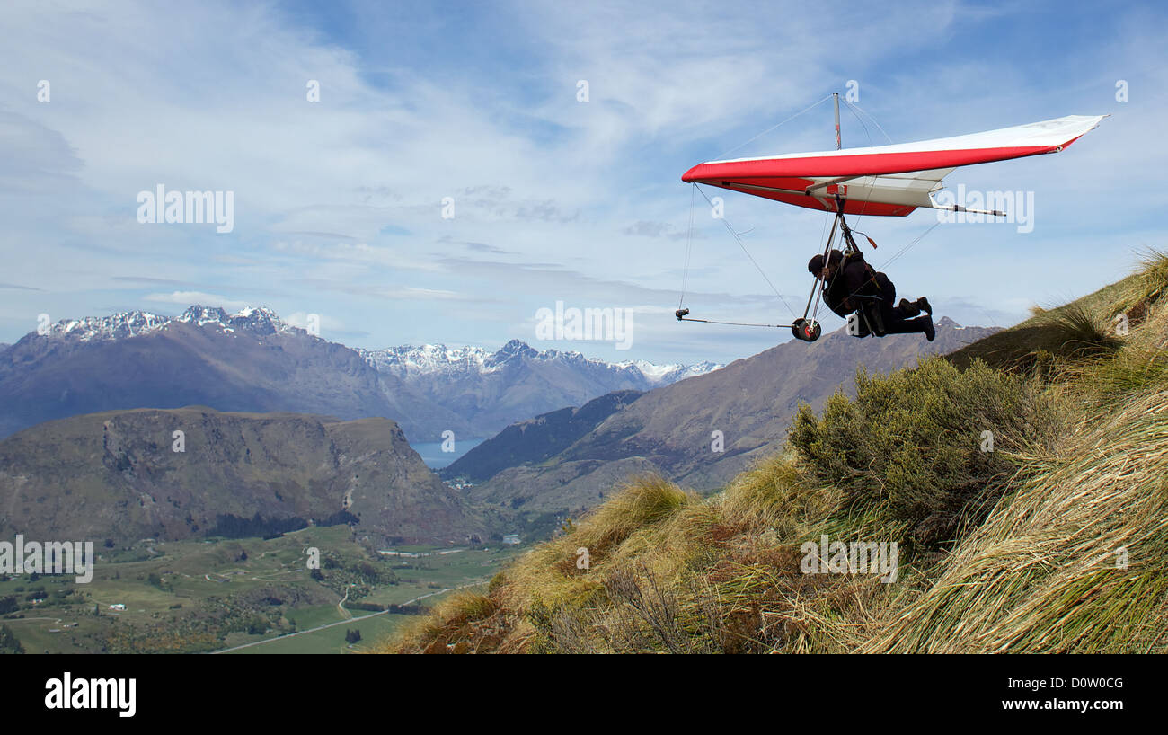 Tandem hang gliding fro Coronet Peak, Queenstown, South Island, New Zealand  Stock Photo - Alamy