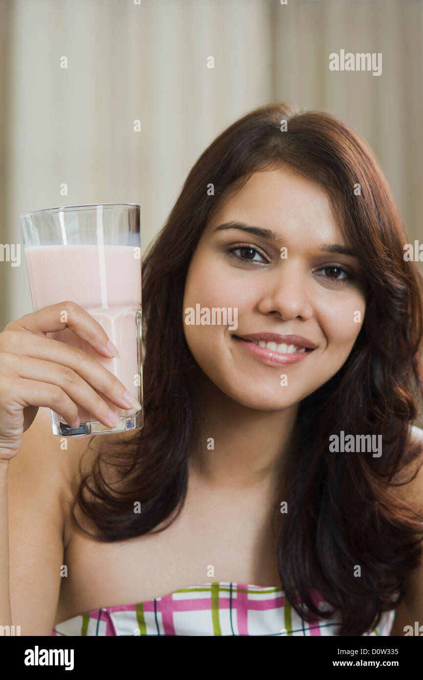 Woman holding a glass of milkshake Stock Photo