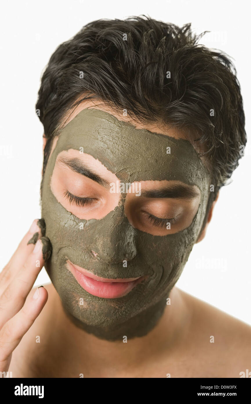 Closeup of a man with mud pack Stock Photo Alamy