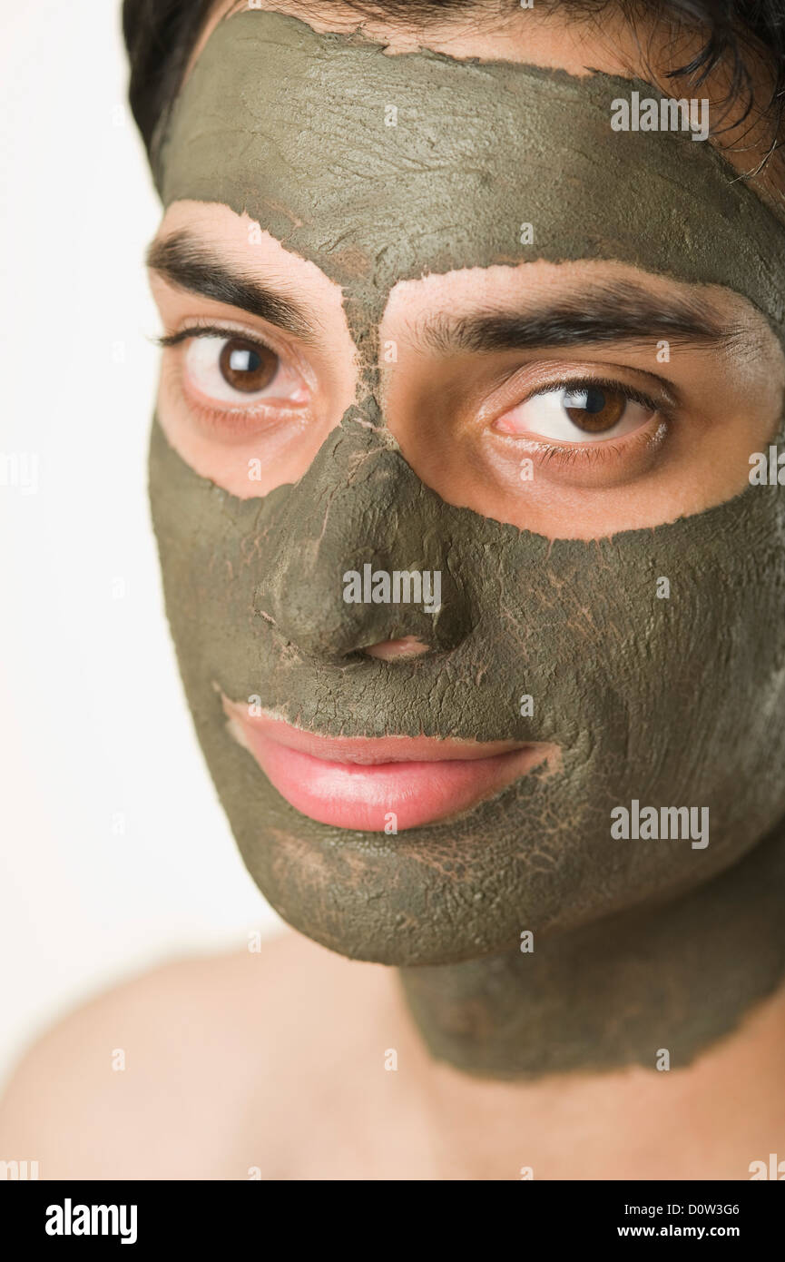 Portrait of a man with mud pack Stock Photo Alamy