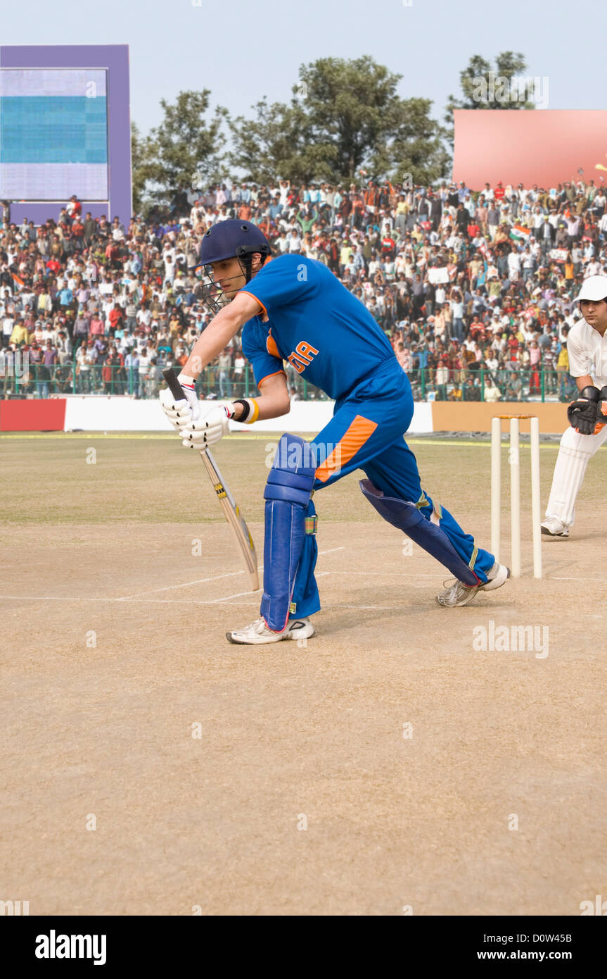 Cricket batsman playing a stroke Stock Photo Alamy