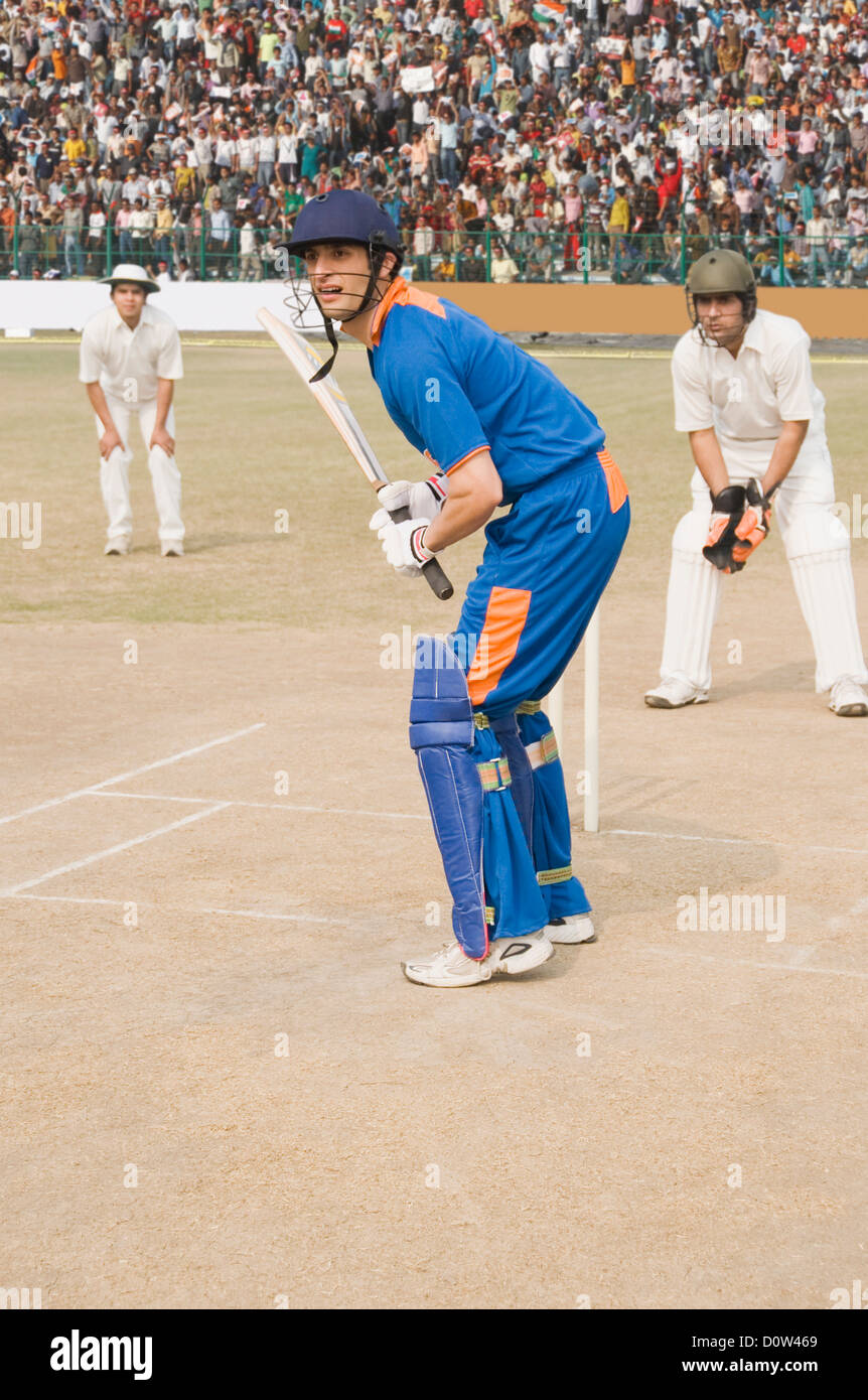 Cricket batsman playing a stroke Stock Photo Alamy