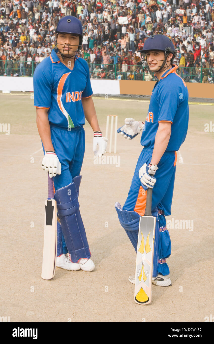 Two cricket batsmen discussing at wicket Stock Photo Alamy