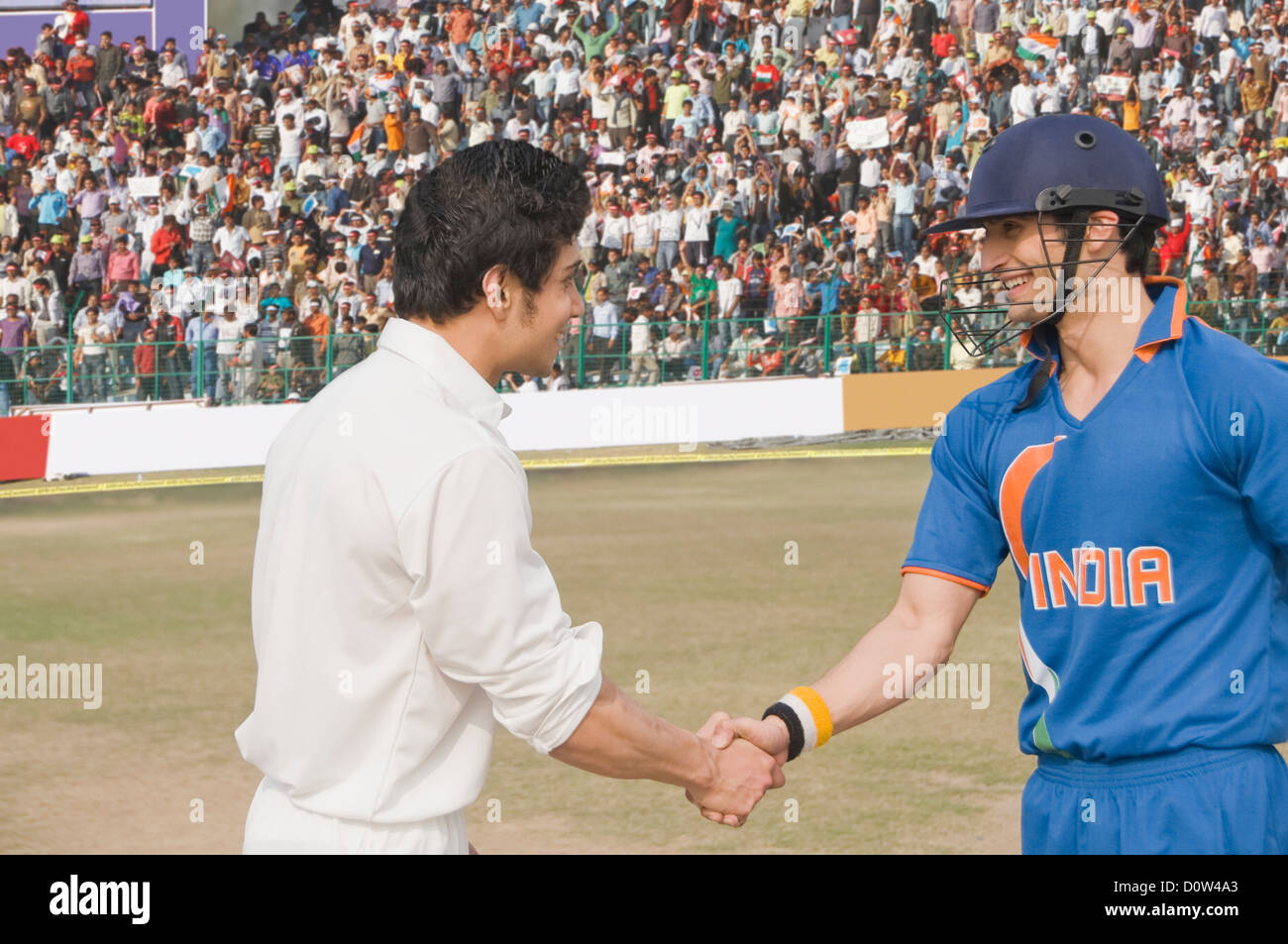 Two cricket players shaking hands Stock Photo Alamy