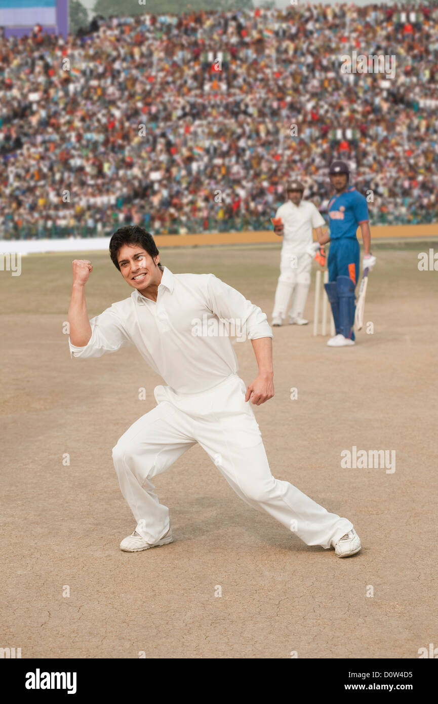 Cricket bowler celebrating his success Stock Photo