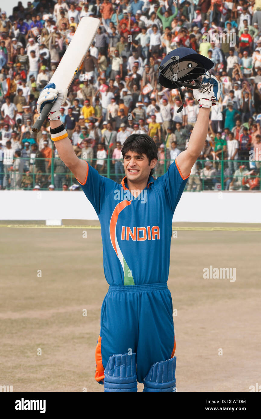 Cricket batsman celebrating success Stock Photo Alamy