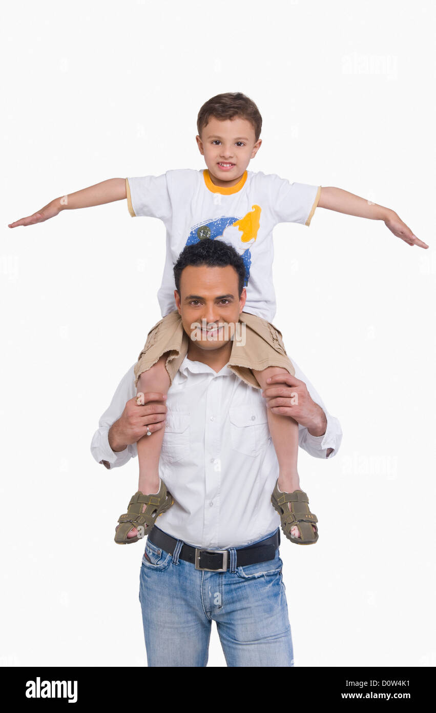 Man carrying his son on shoulders Stock Photo - Alamy