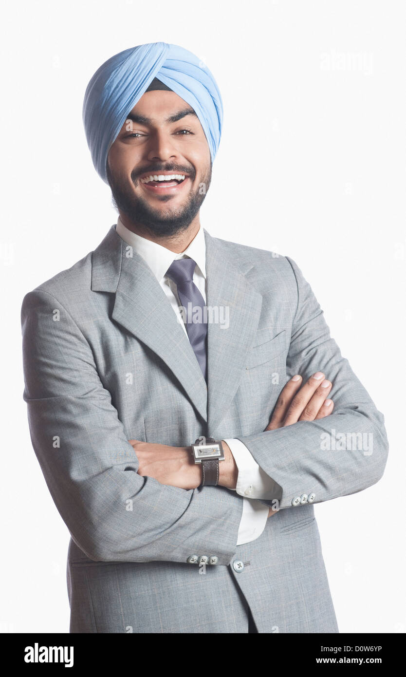 Businessman laughing with arms crossed Stock Photo