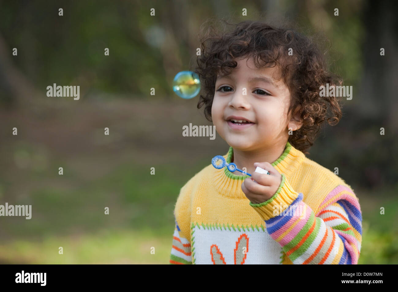 Indian boy blowing bubbles hires stock photography and images Alamy
