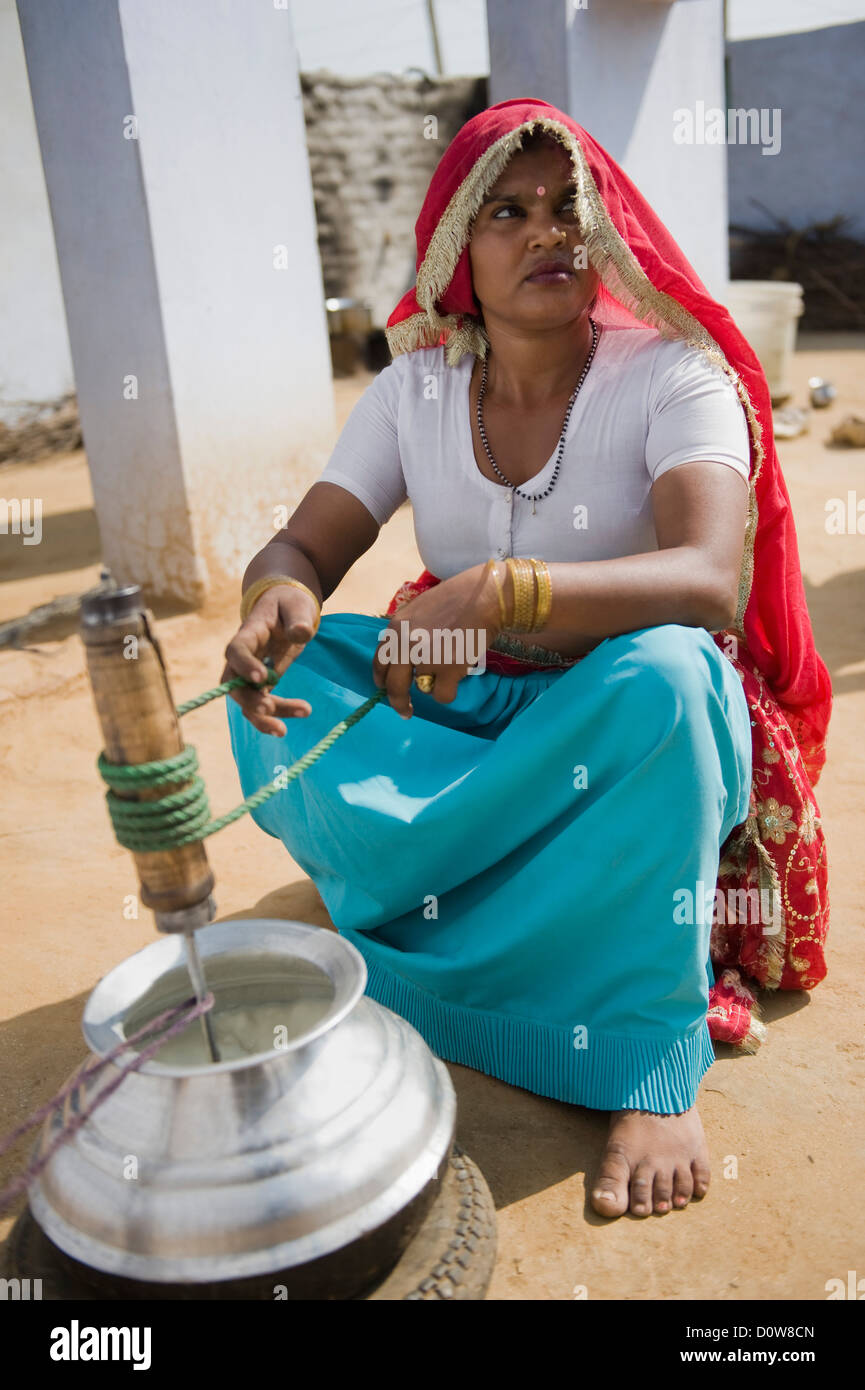 Village woman churning hires stock photography and images Alamy