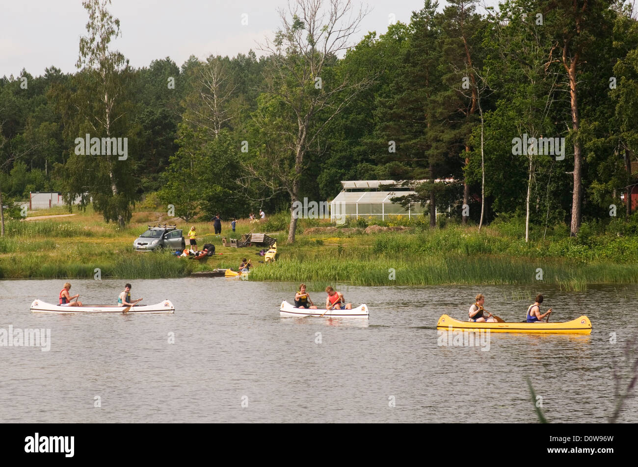 kayak kayaks kayaking canoe canoing row ore ores sweden swedish lake lakes holiday  holidays forest nature countryside Stock Photo - Alamy