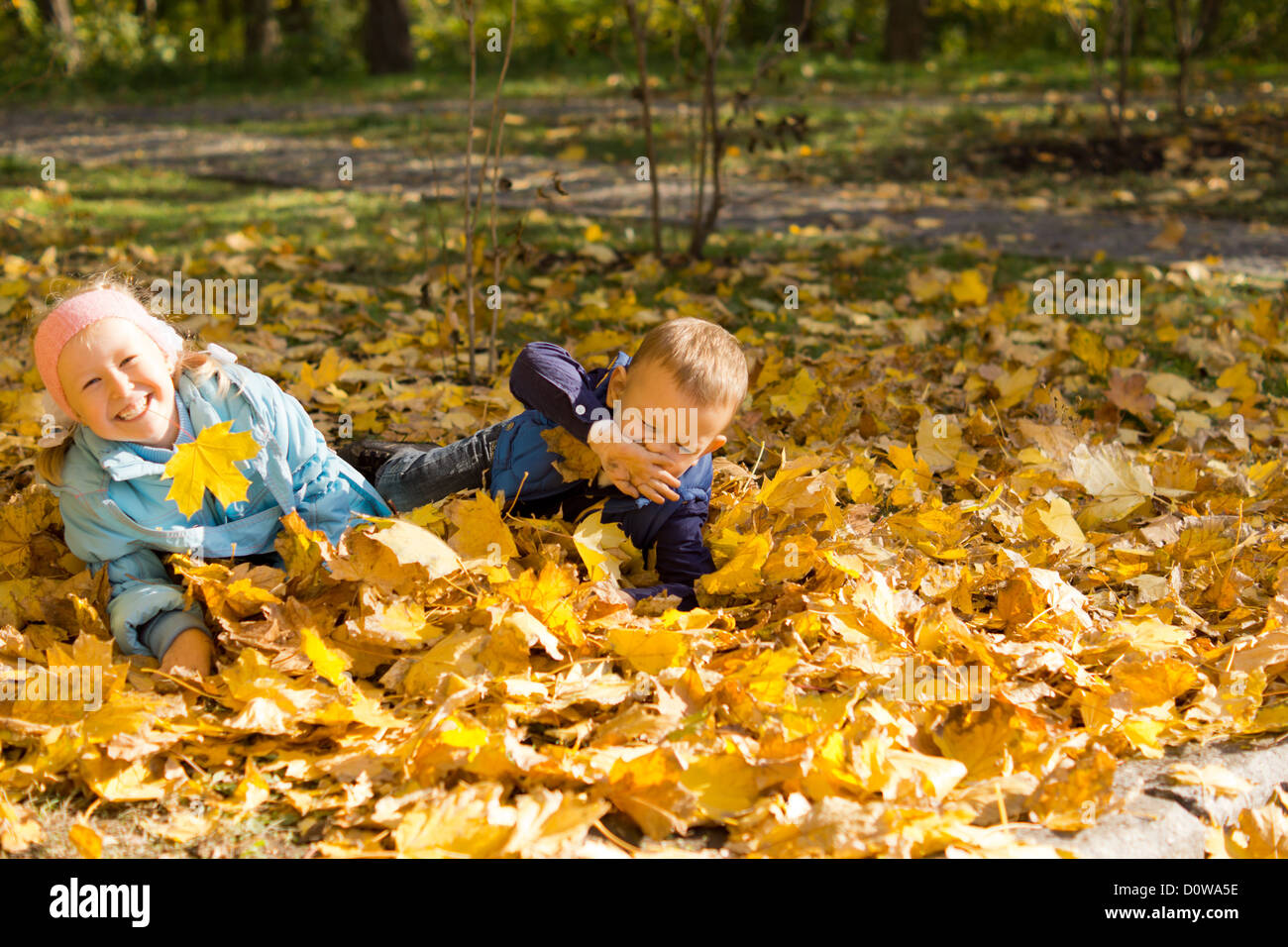 Two Adorable Young Children Having Fun And Games Playing With Autumn Stock Photo Alamy To convey to her the inevitability and our eventual desensitisation language and imagery the voice is that of an older speaker, maybe the poet, addressing a child called margaret in the second person pronoun you. alamy