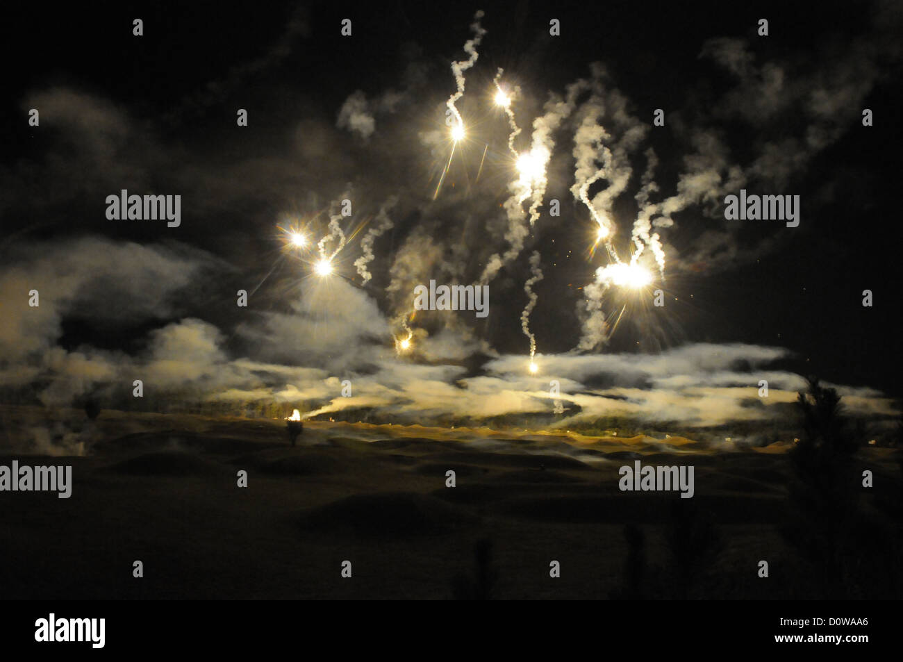 US Army soldiers watch flares light up the night sky during training October 1, 2012 at Fort Lee, Virginia. Stock Photo