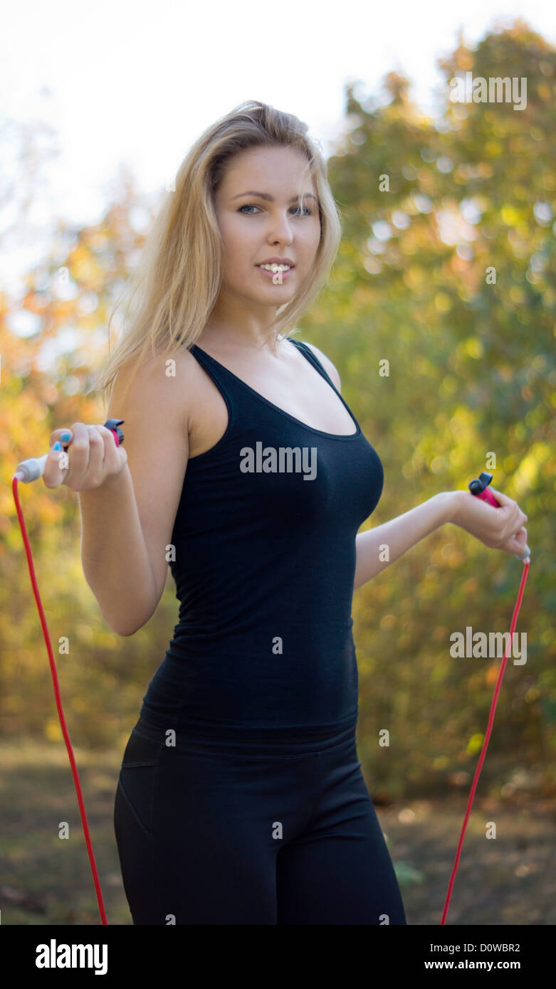 Huge boobs blonde doing jump rope