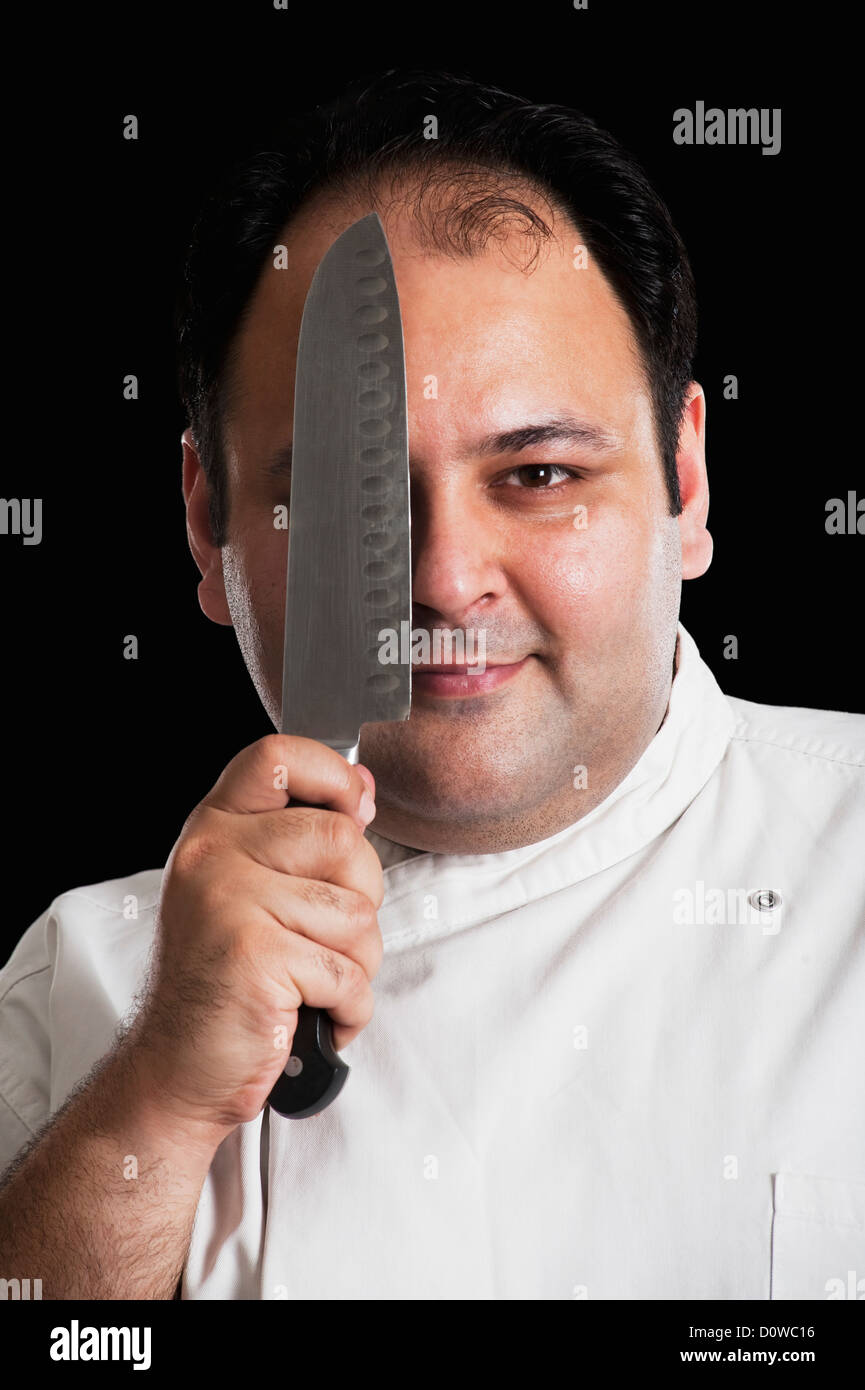 Portrait woman hiding knife hi-res stock photography and images - Alamy