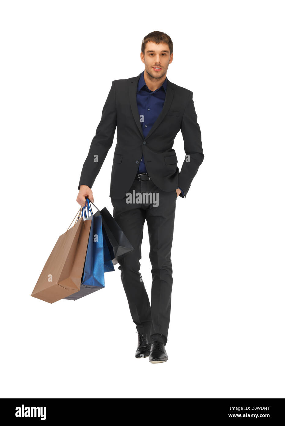 handsome man in suit with shopping bags Stock Photo